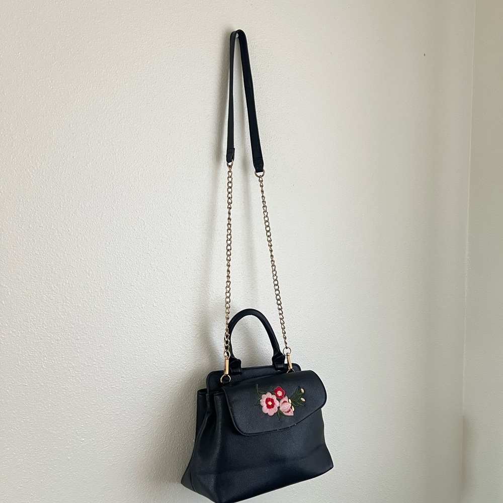 Black Structured Handbag with flower Emblem